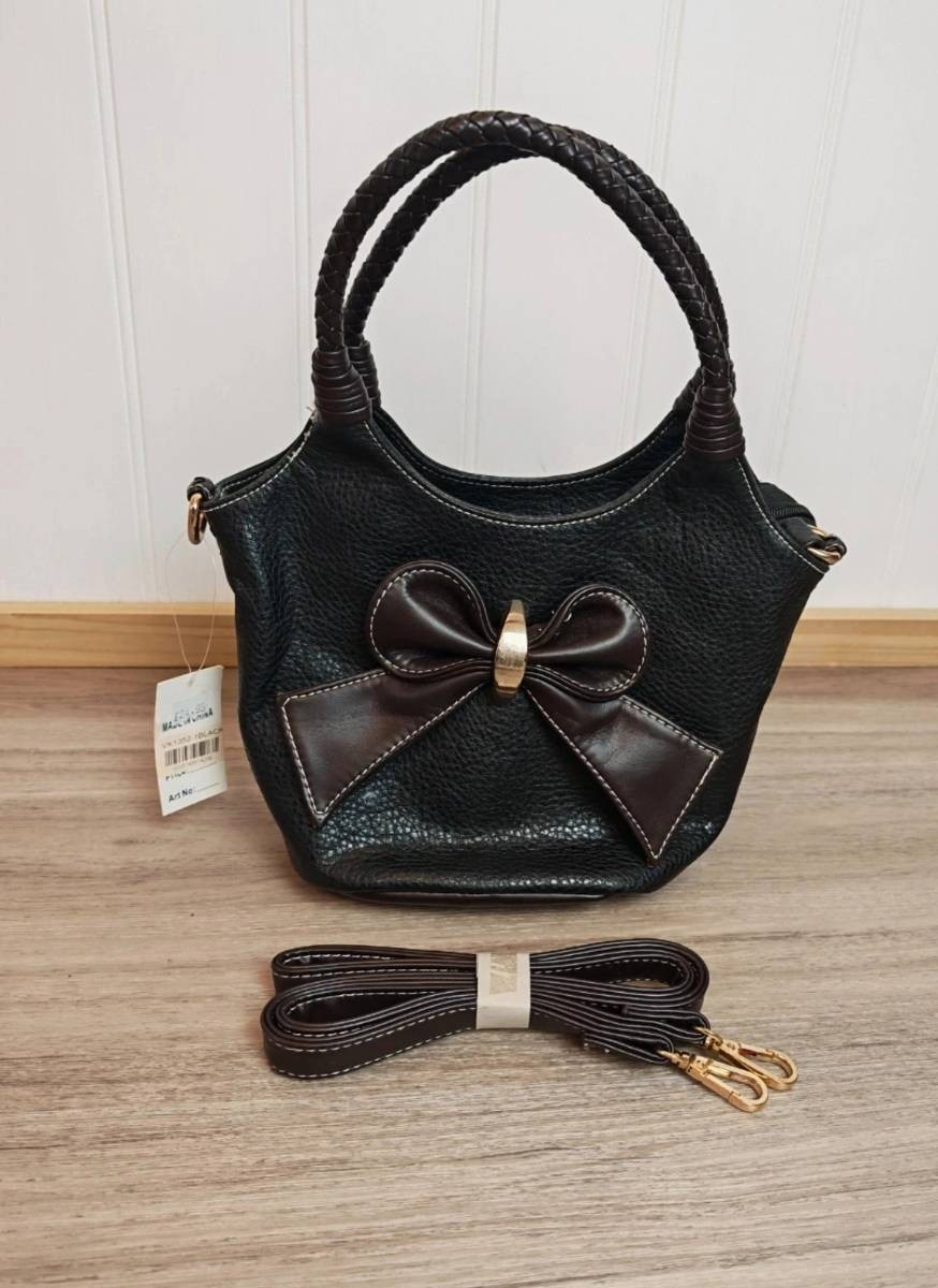 Black faux leathers Acess London handbag, dark brown bow and braided handles